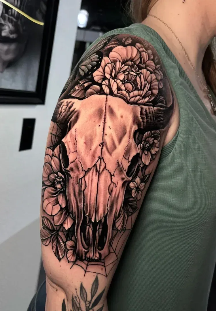 Animal skull surrounded by flowers — Logan Blackshire